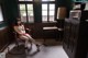 A woman sitting in a chair in a room.